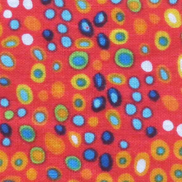 Close up of red circus dots bow tie fabric