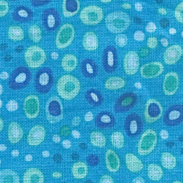 close up of blue circus dots fabric